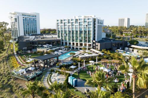 an aerial view of a resort with palm trees and buildings at VEA Newport Beach, a Marriott Resort & Spa in Newport Beach