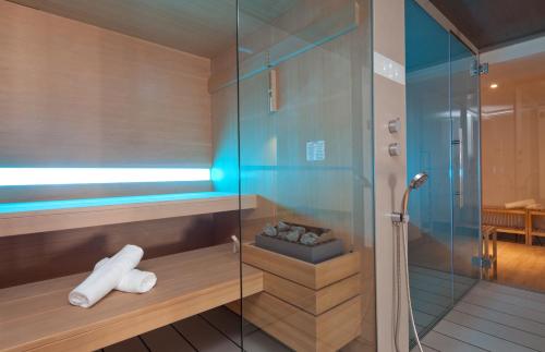 a bathroom with a shower with a glass door at HM Balanguera Beach - Adults Only in Playa de Palma