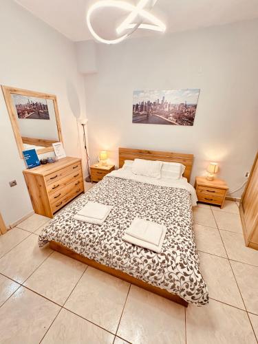 a bedroom with a bed with two towels on it at house in the village 