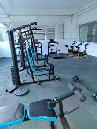 a group of people in a gym with machines at Cozy 2 bedroom apartment With gym &washer near yaya centre in Nairobi