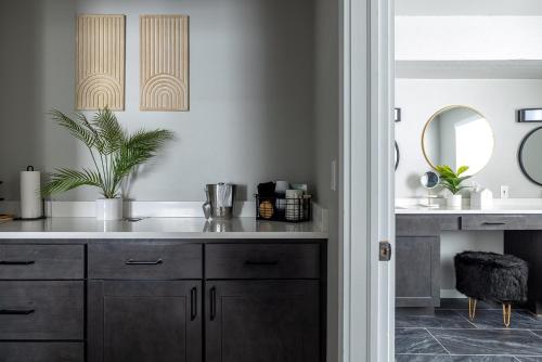 a bathroom with a sink and a mirror at Winter Park Chateau in Winter Park