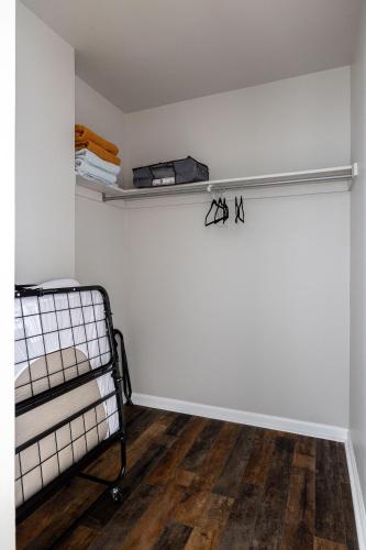 a room with a bed and a wall with a shelf at Winter Park Chateau in Winter Park