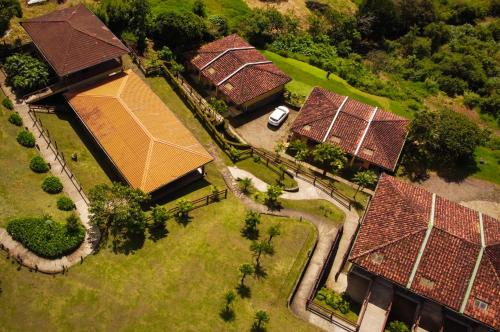 an overhead view of a group of houses with roofs at Hotel Montaña Monteverde in Monteverde Costa Rica