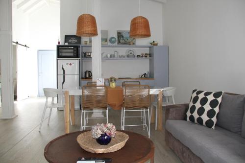a living room with a couch and a table at Loft de playa in Mar del Plata
