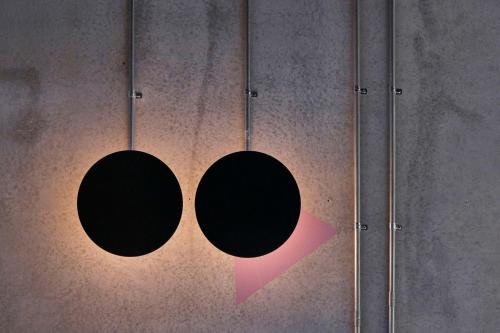 a pair of lights hanging on a wall at Atura Adelaide Airport in Adelaide