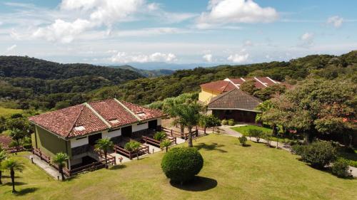 an aerial view of a house with a yard at Hotel Montaña Monteverde in Monteverde Costa Rica