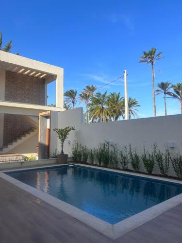 a swimming pool in the backyard of a house at Ap barra grande com piscina in Marau