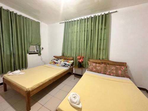 Letto o letti in una camera di Amancio's Balai - Near the Airport, City Center!