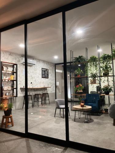 a room with glass doors and a table and chairs at Casa Mayawell in Las Juntas