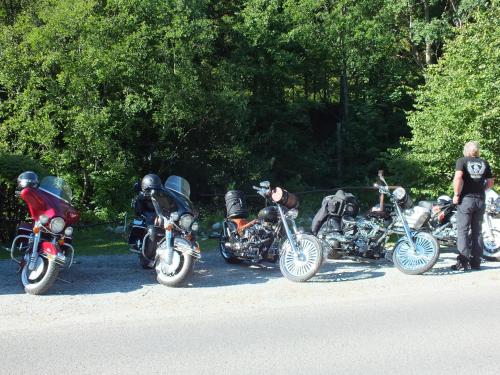 a group of motorcycles parked on the side of a road at Goralturist in Ždiar