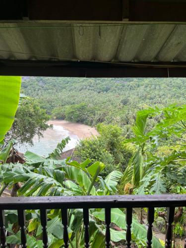 a view of a beach from a balcony at Silver cliff room 12 in Than Sadet Beach
