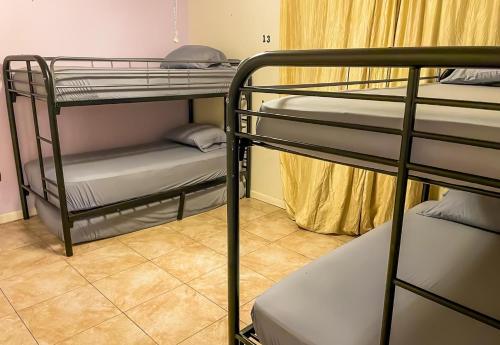 a room with two bunk beds in a hostel at Beds & Sheets DOWNTOWN in Miami