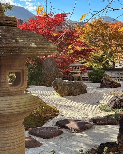 a stone path in a japanese garden at Onsen & Garden -Asante Inn- in Hakone