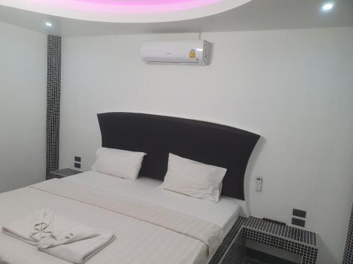 Ένα ή περισσότερα κρεβάτια σε δωμάτιο στο Momento Resort