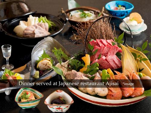 a table with a plate of sushi and other foods at Hyoe Koyokaku in Kobe
