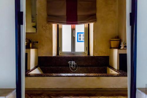an open door to a room with a window at Madada Mogador in Essaouira