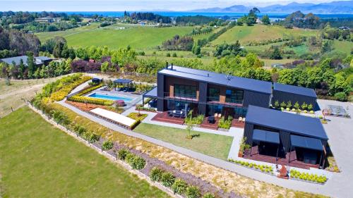 an aerial view of a house with a garden at Harakeke Boutique Accommodation in Mahana