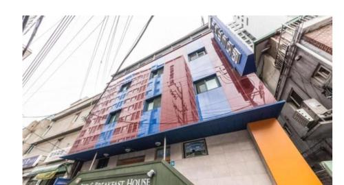 a building with a sign on top of it at Brown Hotel in Seoul