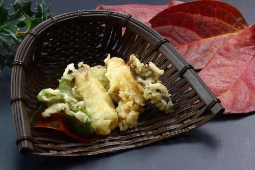 a basket with food in it on a table at Baigetsu Ryokan in Shimo-suwa