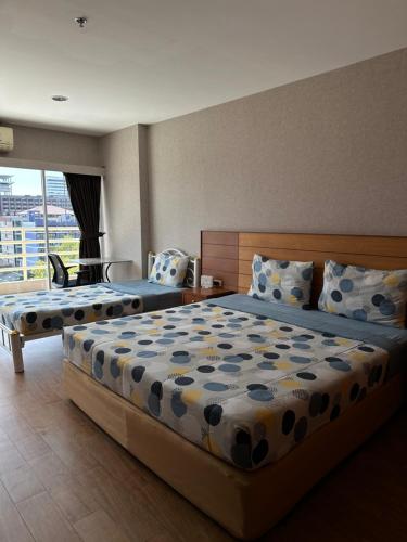Llit o llits en una habitació de View Talay6 by Blue Ocean Suite