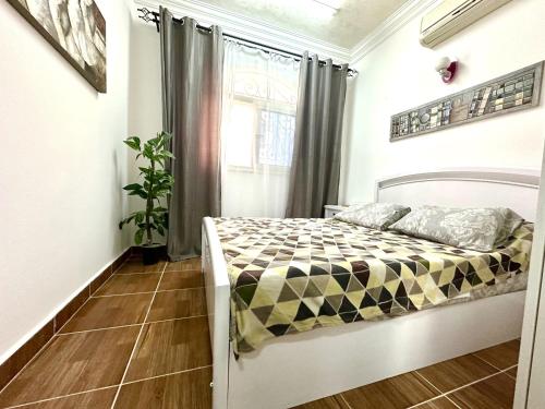 Ένα ή περισσότερα κρεβάτια σε δωμάτιο στο Karibu House Sheraton Road