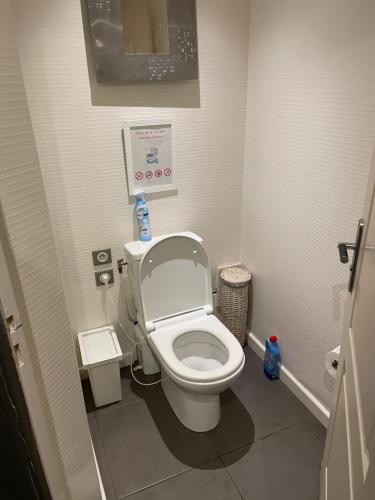 a small bathroom with a toilet in a stall at Relaxed appartment in Melun