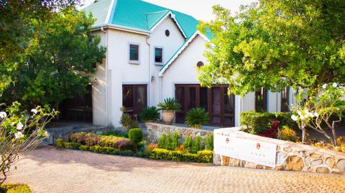 Κήπος έξω από το Candlewoods Guesthouse