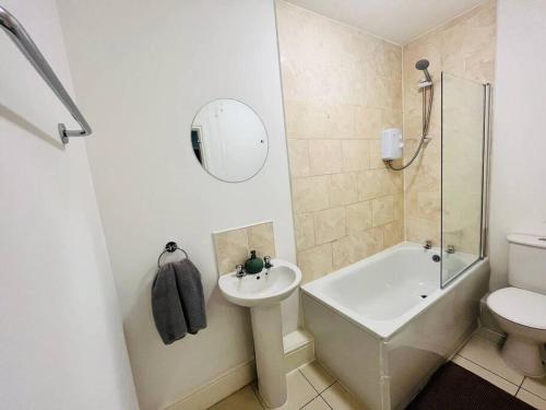 a bathroom with a sink and a toilet and a shower at Urban and stylish Central Studio Apartment in Liverpool with high speed free wifi in Liverpool