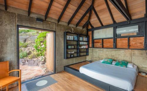 a bedroom with a large bed in a room at Saint Barth Villa 8 in Pointe Milou