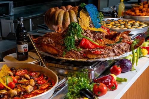 a buffet with many different types of food on a table at SUN HEAVEN FAMILY & SPA in Alanya