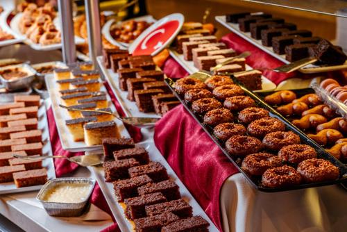 a buffet filled with lots of different types of desserts at SUN HEAVEN FAMILY & SPA in Alanya