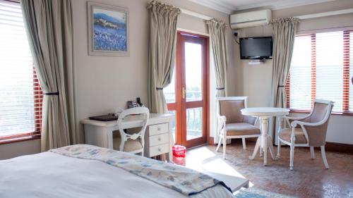 Ένα ή περισσότερα κρεβάτια σε δωμάτιο στο Candlewoods Guesthouse