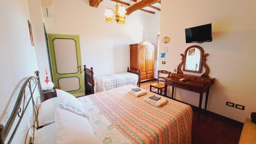 Ένα ή περισσότερα κρεβάτια σε δωμάτιο στο Agriturismo Abbazia Sette Frati a casa di Sara