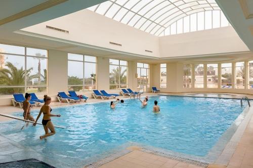 a group of people in a swimming pool at Vincci Dar Midoun in Djerba