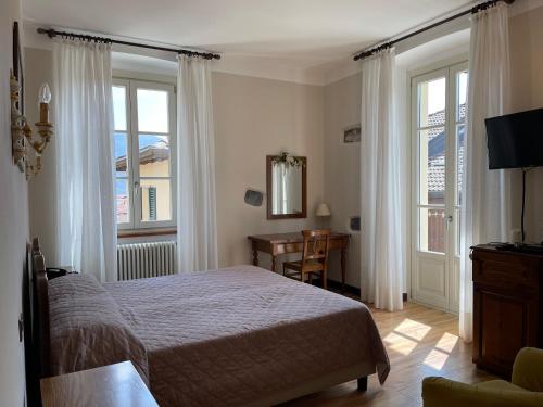 Postel nebo postele na pokoji v ubytování Hotel La Torre