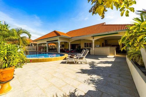 a house with a swimming pool in a yard at 3 Bedroom Pool Villa Close to City Center! S102 in Hua Hin