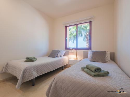 Llit o llits en una habitació de Apartamento Nueva Ribera Beach Club No 78