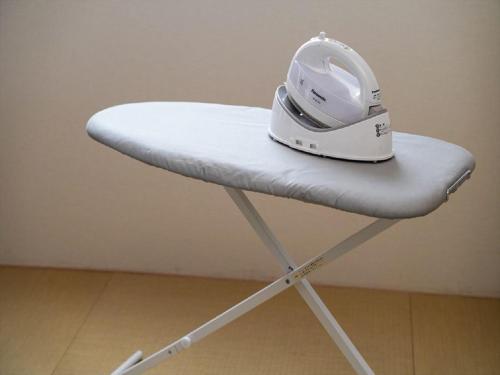 a white helmet sitting on top of a chair at MIMARU Kyoto Shinmachi Sanjo in Kyoto