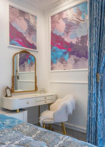 a bedroom with a dressing table and a mirror at Súp Lơ House (Broccoli's House) in Da Lat