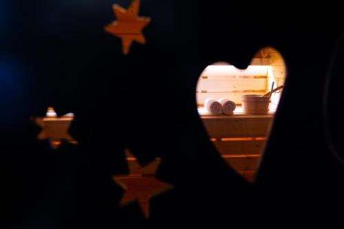 a view of a kitchen through a heart shaped window at Arka Art Hotel in Tirana