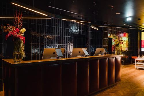 a bar with a bunch of computers on it at sly Berlin in Berlin