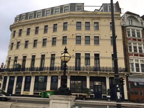 a building with a street light in front of it at Imperial House "Serviced Apartments" in Margate