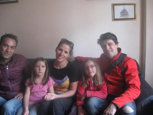 a group of people sitting on a couch at k2Homes in Pātan