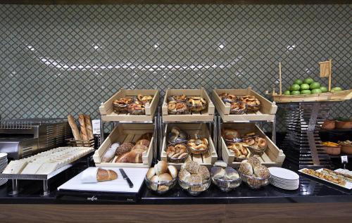 a buffet with many different types of bread and pastries at Uranus Istanbul Topkapi in Istanbul