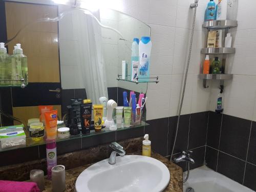 a bathroom with a sink and a mirror at Beautiful Apartment Holiday with Terrace, Casablanca in Casablanca