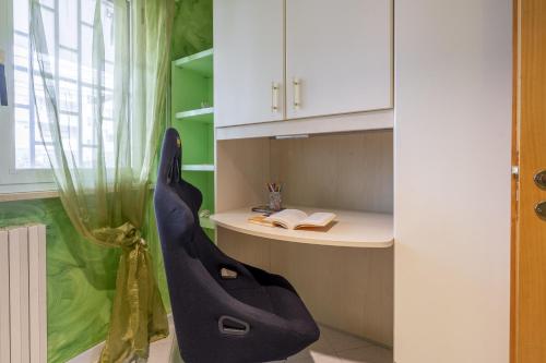 a room with a desk and a chair in a room at Green house in Monopoli