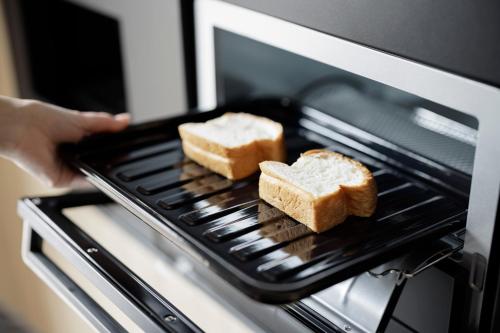 two pieces of bread on a rack in an oven at Fairfield by Marriott Tochigi Utsunomiya in Utsunomiya