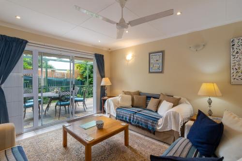 a living room with a couch and a table at Dunwerkin Self Catering in Kenton on Sea