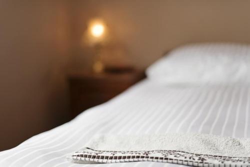 a close up of a white bed in a room at Winnica Mozów in Mozów