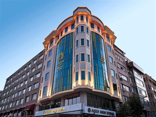 a tall building with an orange and blue facade at All Seasons Suites in Istanbul